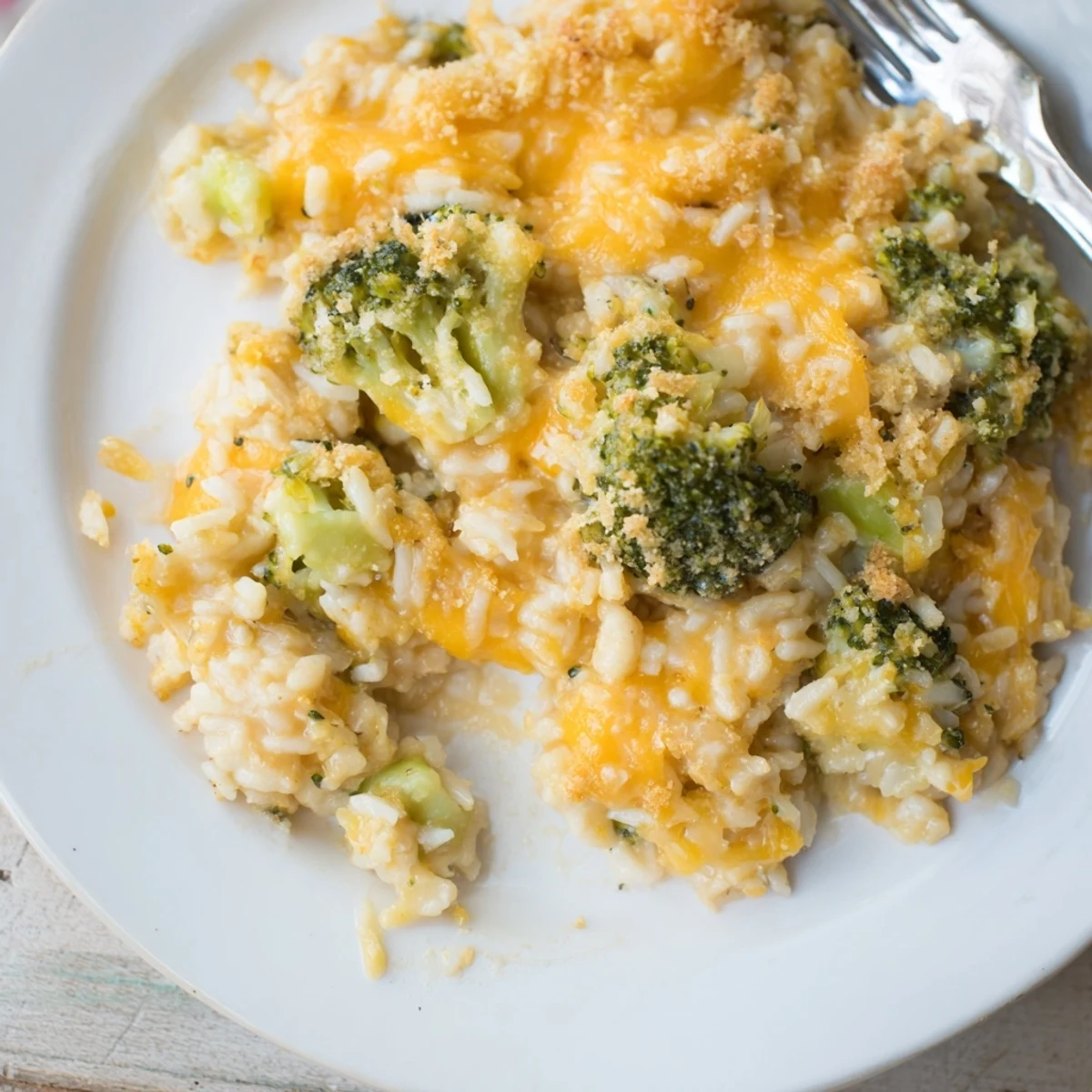 Creamy Cheesy Broccoli and Rice Casserole topped with golden breadcrumbs and melted cheese.  