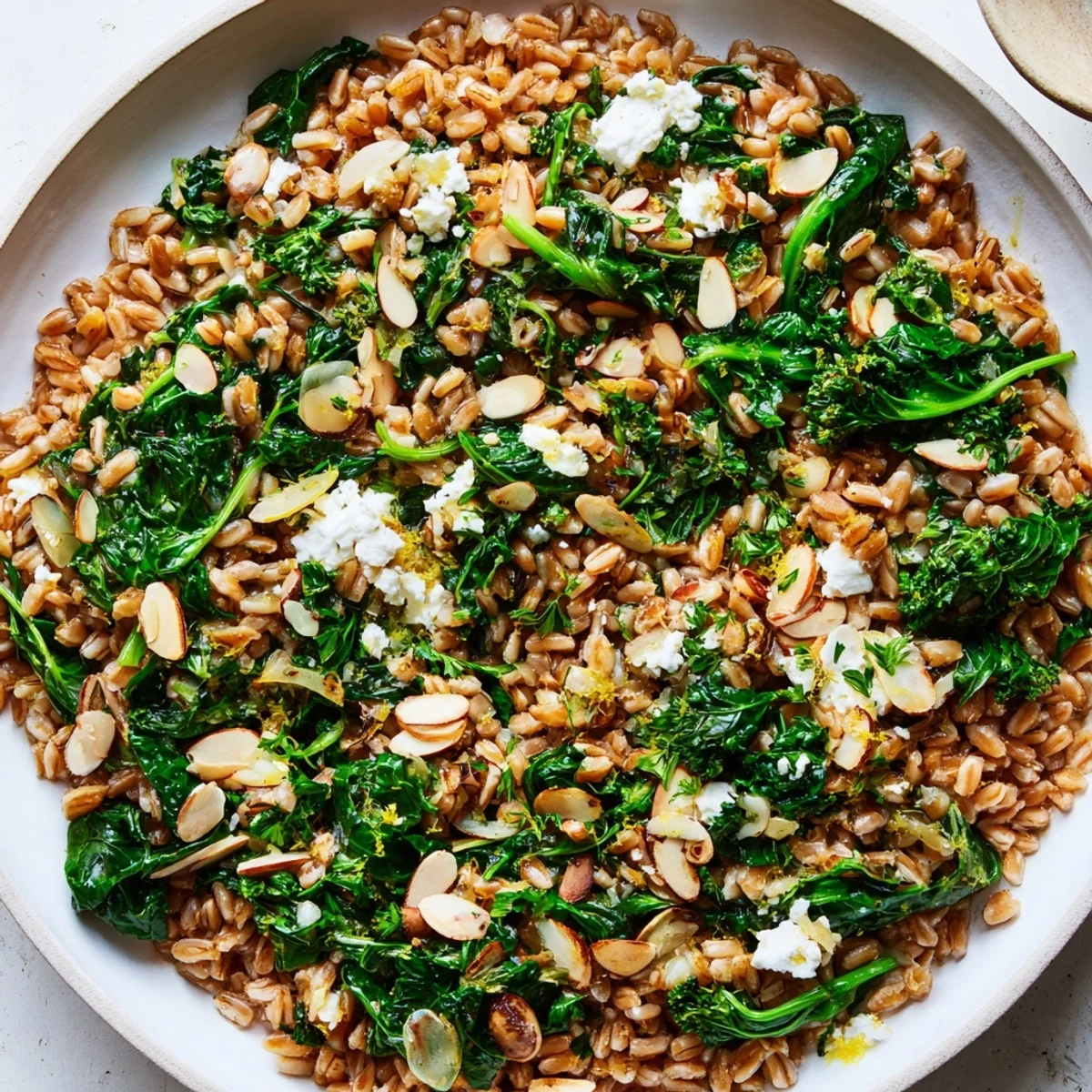 Close-up on a delicious Warm Farro & Greens Pilaf, presenting the colorful textures of a healthy dish.