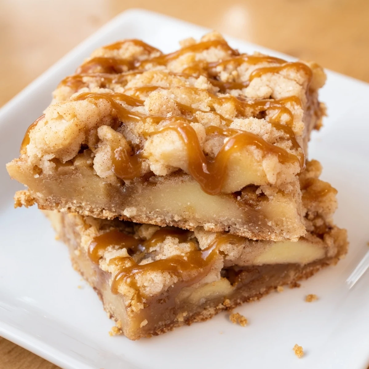 Delicious sweet and chewy autumn Caramel Apple Cookie Bars, brimming with caramel and apples.