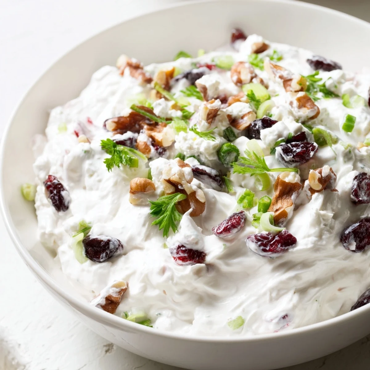 Tangy Lightened Holiday Cream Cheese Dip, ready to serve with crackers, a perfect party snack.