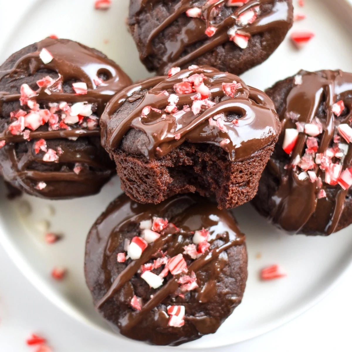 Fudgy, rich Peppermint Mocha Brownie Bites, freshly baked and topped with a glistening peppermint glaze.