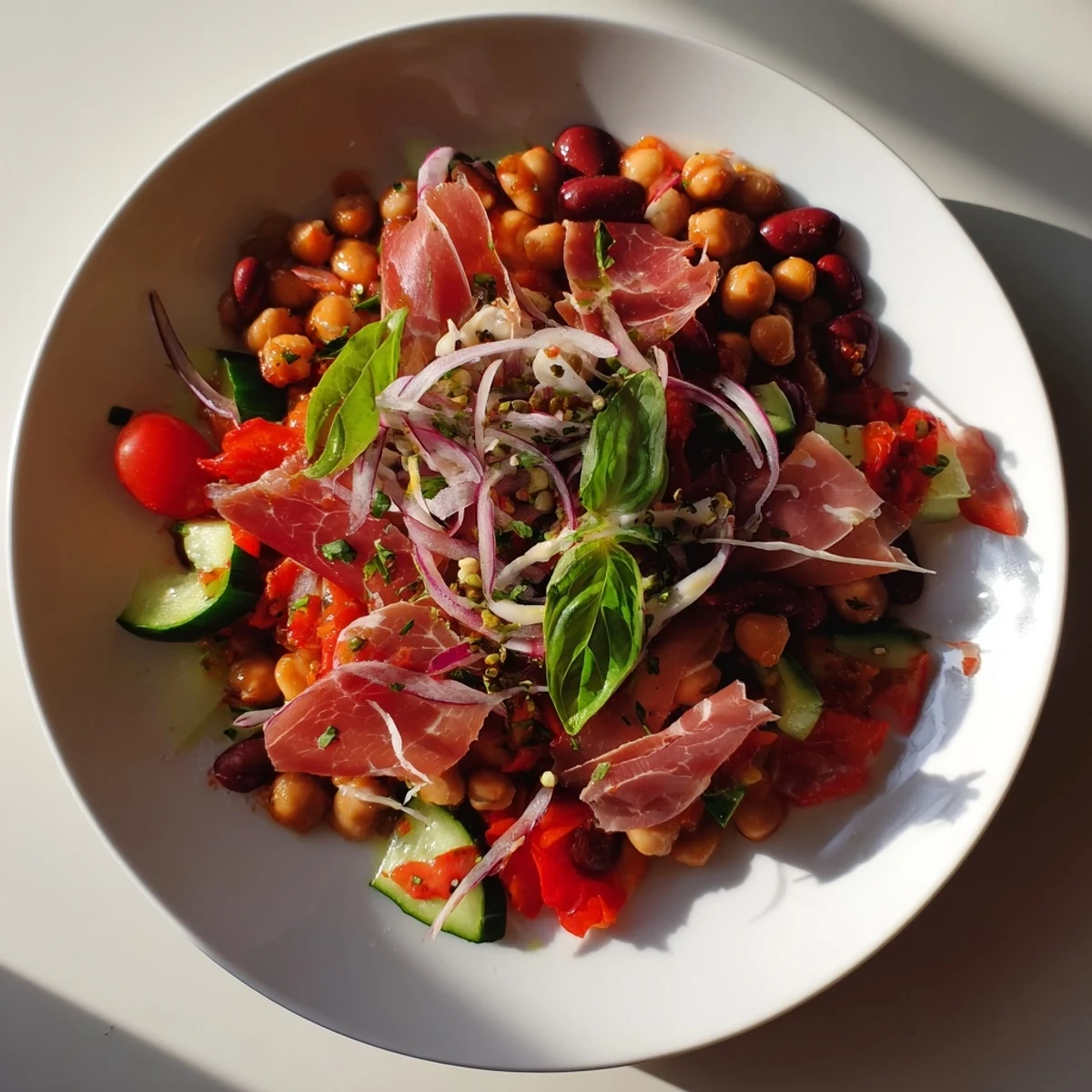 Vibrant Dense Bean Salad with Prosciutto: colorful ingredients & salty prosciutto ribbons ready to eat.