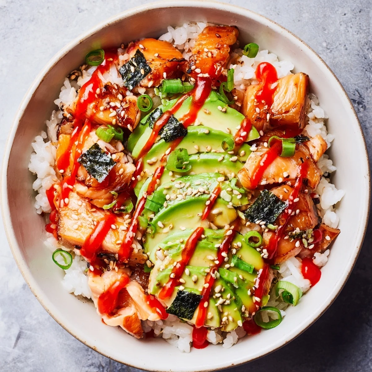 Flaky salmon atop seasoned rice makes a comforting Classic Salmon Rice bowl for a quick dinner.