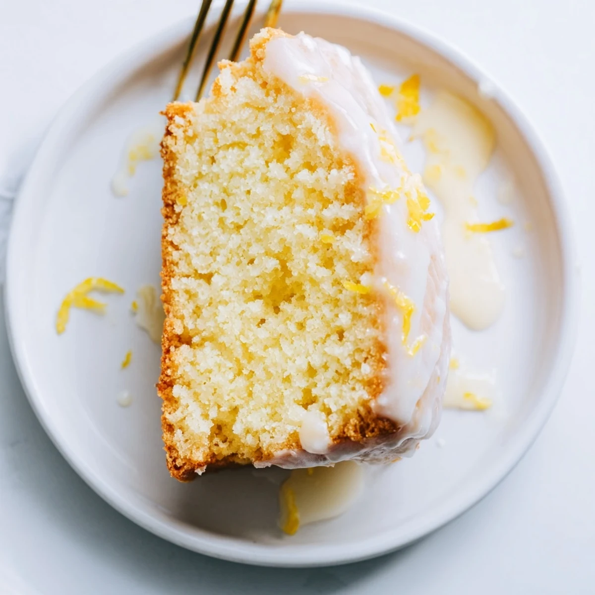 A golden-crusted Lemon Yogurt Cake, showcasing a delicious crumb, perfect for dessert tonight.