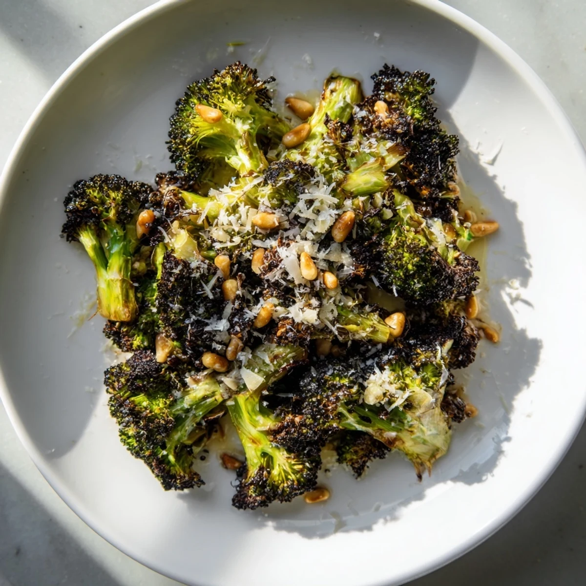 Delicious, simple recipe for a flavor-packed, healthy Charred Broccoli Salad with toasted nuts.