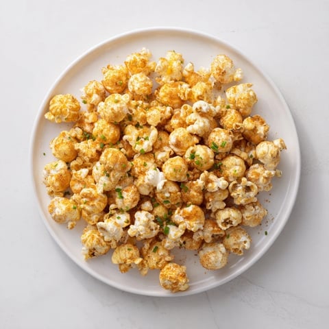 A vibrant bowl of savory popcorn mixes, ready to share, offering various unique flavors.