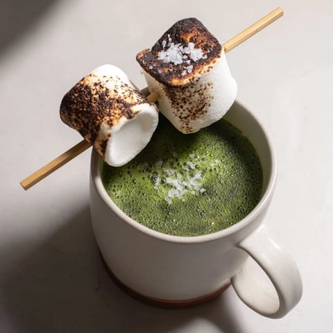 Warm Toasted Marshmallow Campfire Matcha Hot Cocoa, topped with perfectly browned, gooey marshmallows, smells divine.
