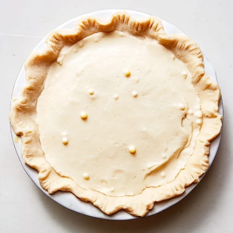 A slice of chilled Water Pie, offering a light, refreshing taste and comforting texture.