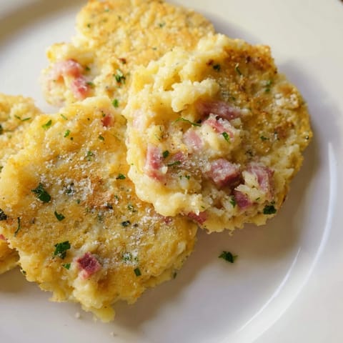 Imagine these warm Depression-Era Ham & Potato Patties, served with a dollop of ketchup, delightfully crisp.