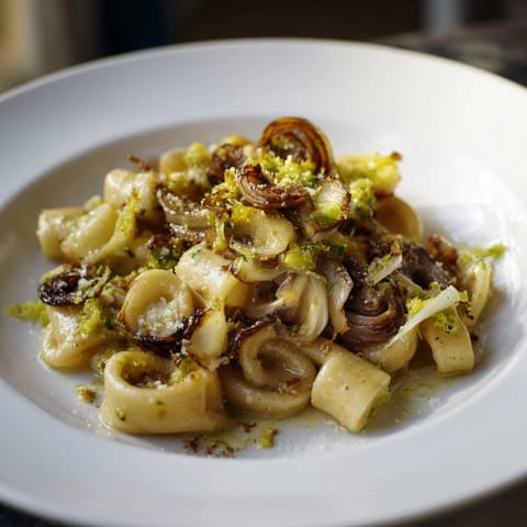 Golden-brown caramelized onions and ditalini pasta combine in this creamy French onion soup pasta.