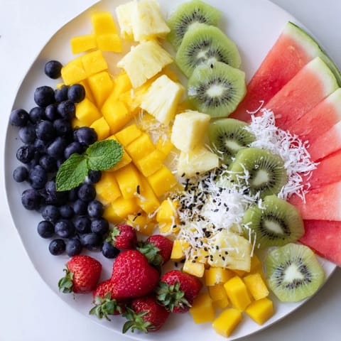 Vibrant Tropical Pineapple Platter, the perfect healthy dessert with juicy mango and berries.