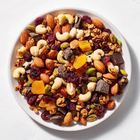 Golden raisins and chocolate chunks are seen amongst the ingredients in the Mountain High Adventure Snack Mix.