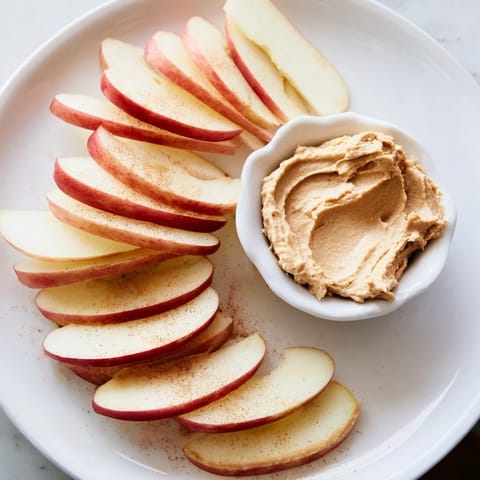 Enjoy the simple pleasure of fresh apple slices with a homemade peanut butter dip.