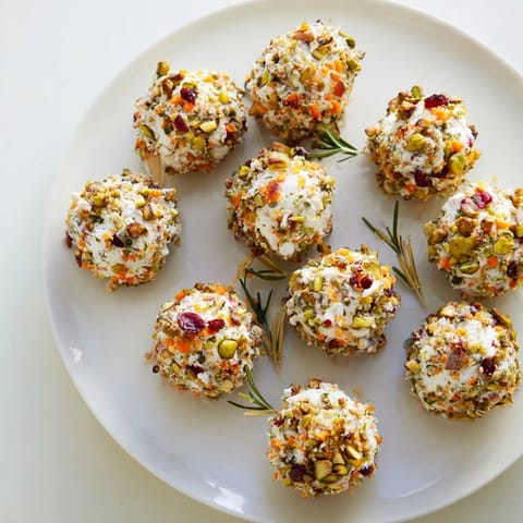 Bright, colorful Holiday Ornament Clusters appetizer platter, ready for your festive celebration with cheese balls.