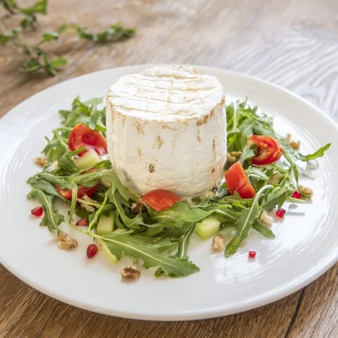 Exquisite arrangement of colorful produce around the Zenith Point cheese, ready to be drizzled with dressing.