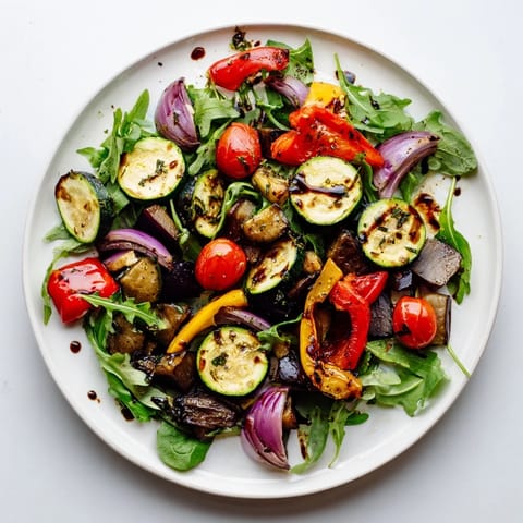 A close-up view shows a delicious Roasted Vegetable Salad, perfect for a fresh summer meal idea.