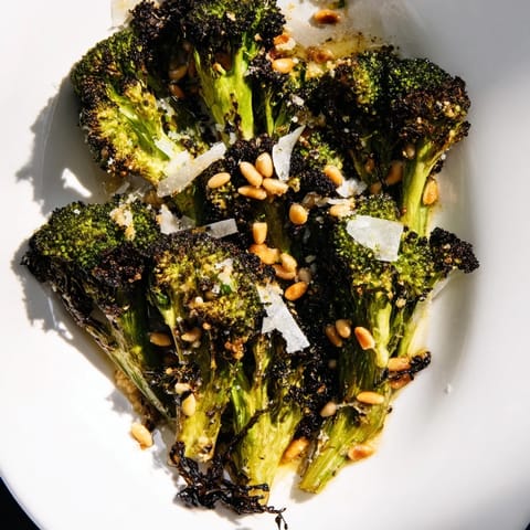 Smoky-edged roasted broccoli salad, tossed with Parmesan and lemon, ready to eat now.