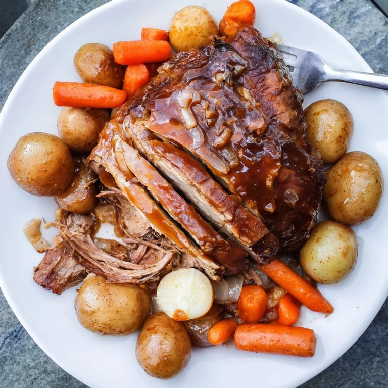 Mouthwatering slow cooker honey garlic pork roast served with fresh green beans.  
