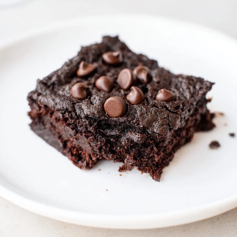 A close-up shot of rich and moist Black Bean Brownies, perfect for satisfying your chocolate cravings.