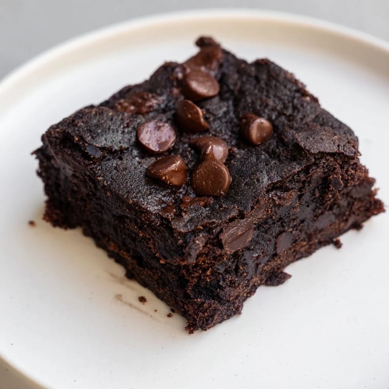 Warm, freshly baked Black Bean Brownies, offering a healthier, protein-packed, and fudgy slice of heaven.