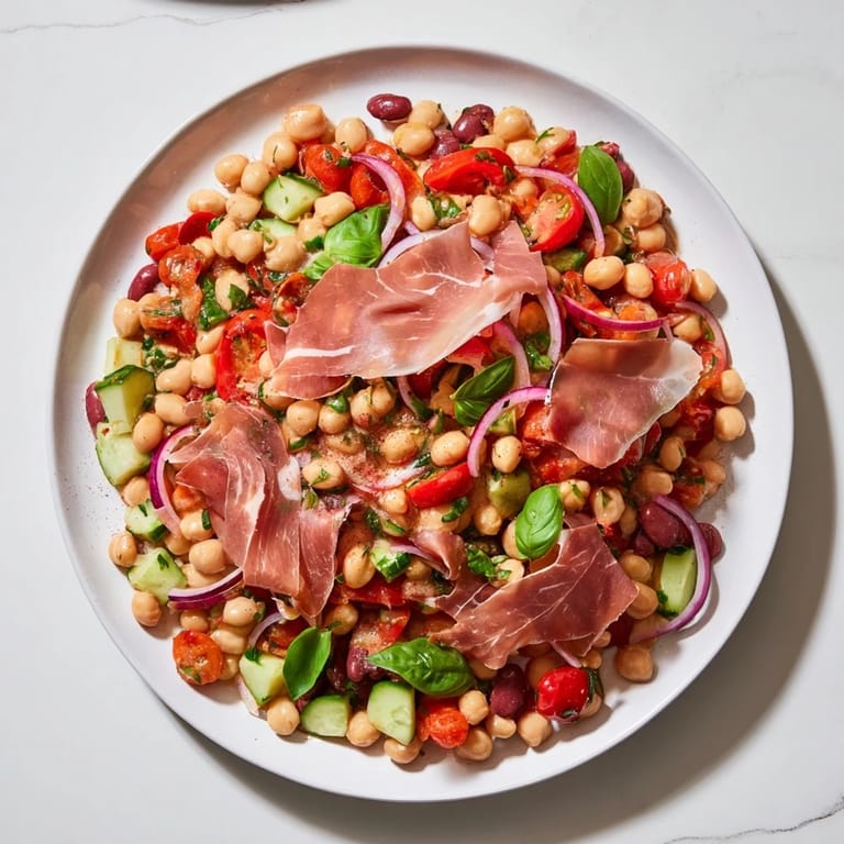 Italian-inspired Dense Bean Salad with Prosciutto: a textural delight, combining beans, veggies, and savory prosciutto.