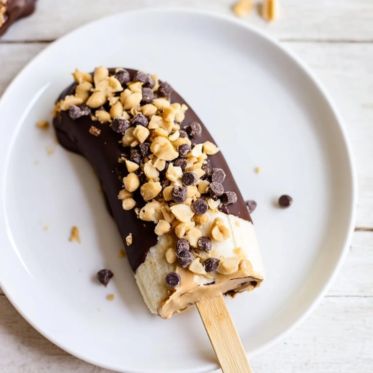 Homemade Frozen Banana Chocolate Pops offer a cool, refreshing treat, perfect for any summer day.