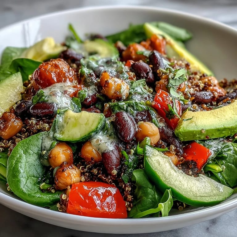 A fork rests beside the wholesome Three-Bean Power Bowl, filled with quinoa and beans.